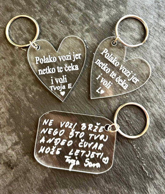 Prozirni privjesak za ključeve s tekstom